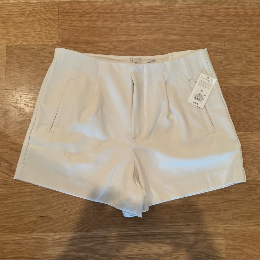 NWT cream shorts, size 12